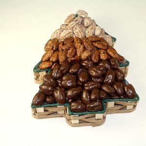 Various nuts in christmas tree shaped tin