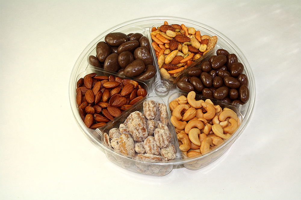 Nut candy tray with almonds, pecans, cashews, and chocolate covered nuts